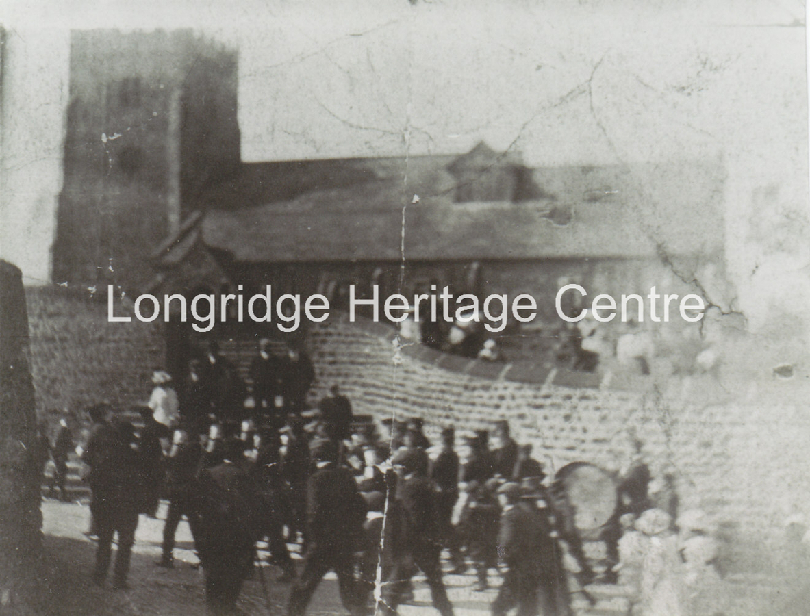 254B - Chipping Brass Band - In action passing the church - Unknown